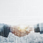 business partners handshake global corporate with technology concept